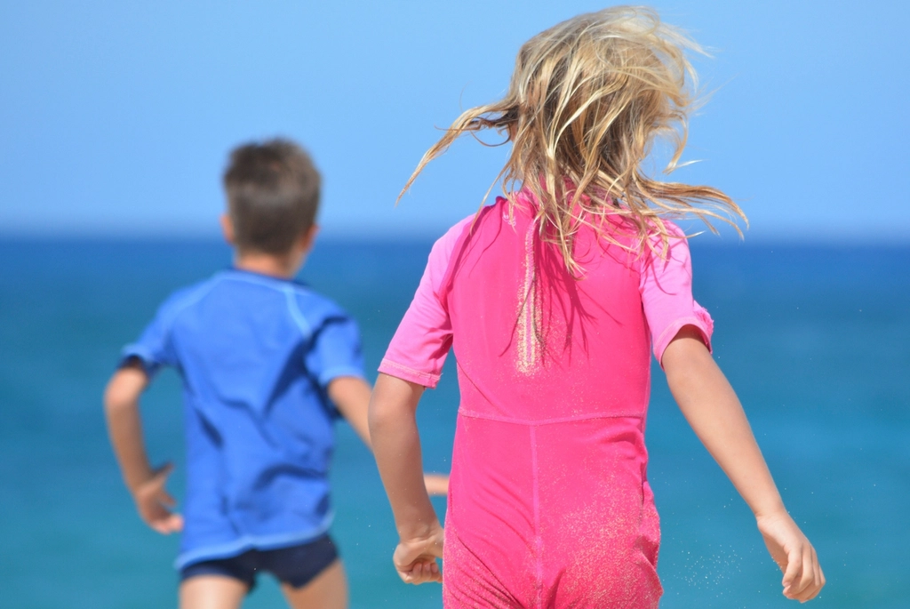 Kids running beach