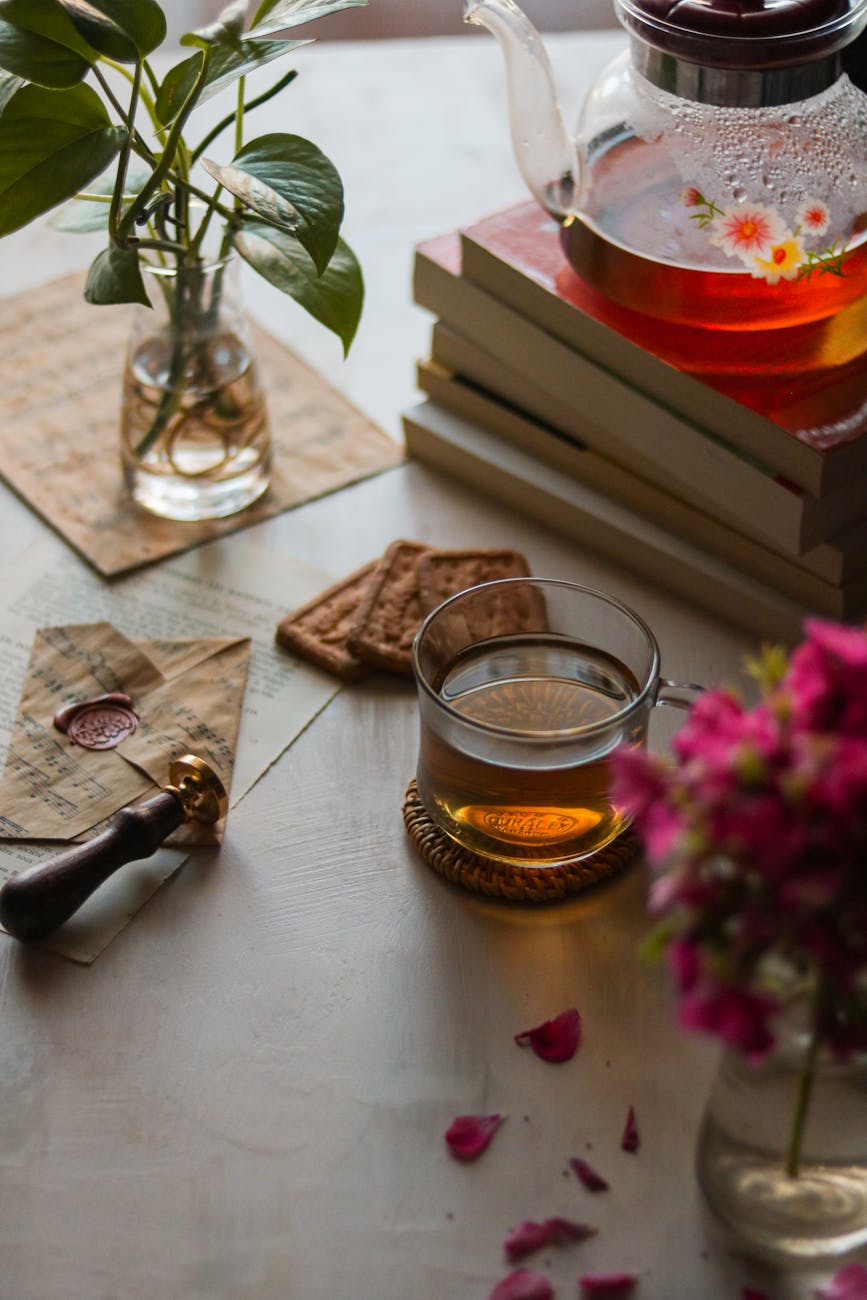 tea in glass near kettle